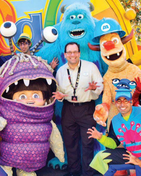 Chip Koch with Disney characters